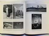 an open book with pictures of people and airplanes in it