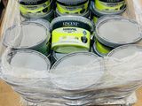 many cans of paint in a plastic container on a table