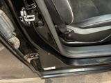 a picture of the inside of a car with the door open
