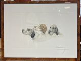 une photo d'une photo représentant trois chiens posés sur une table