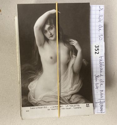 a picture of a naked woman with a pencil in her hand