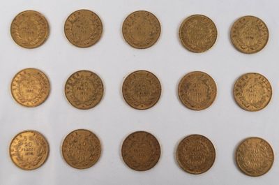 a group of gold coins sitting on top of a white surface