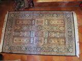 an overhead view of a rug on the floor in a living room