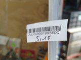 a label on the door of a store that has a price tag attached to it