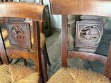two wooden chairs that are sitting next to each other