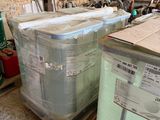 many boxes of mattresses sitting on pallets in a warehouse