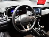 a steering wheel and dashboard of a car on display at a car show