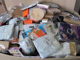 a cardboard box full of items that are sitting on the floor