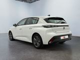 the rear of a white toyota mira hybrid parked in a room