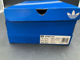 a close up of a blue box with a white stripe on it