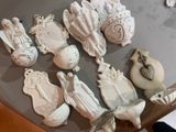 a lot of ceramic figurines sitting on a table
