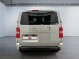 citroen van parked in a large room with white walls