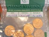 a bag of coins sitting on a table with a price tag
