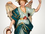 a statue of an angel and a child on a pedestal