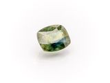a green tourmaline gemstone on a white background