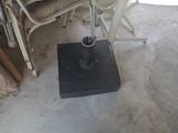 a chair that is sitting next to a stack of chairs