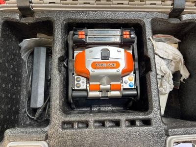 an orange and white toy truck inside of a case