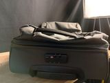 a piece of luggage sitting on top of a wooden table