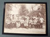an old photo of a group of people posing for a picture