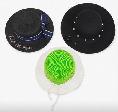 two hats with a green ribbon and a black hat with a green ribbon