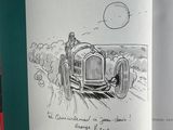 a book with a drawing of a man driving a car