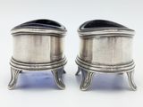 pair of silver plated salt and pepper shakers on stands