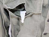 a close up of a jacket with a tag on it