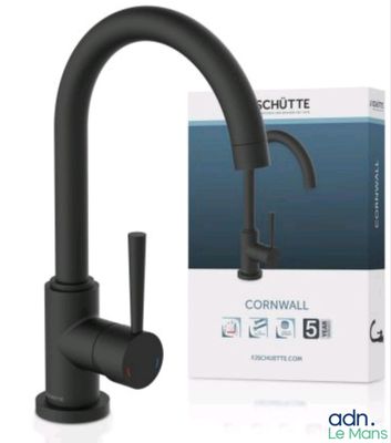 a close up of a black faucet with a box in the background