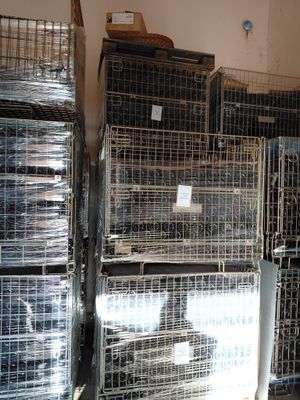 many cages that are stacked on top of each other
