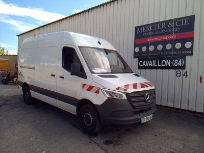 a white van that is parked in front of a building