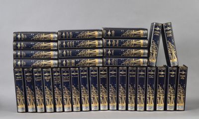 the twelve books are stacked on top of each other on a table
