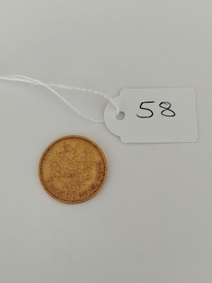 a gold coin with a price tag attached to it