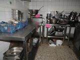 many pots and pans on the counter in the kitchen