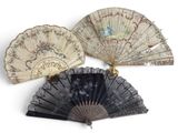 several antique fans are lined up on a white surface