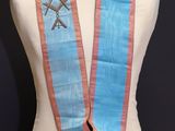 an image of a mannequin with a blue and pink sash on a mannequin