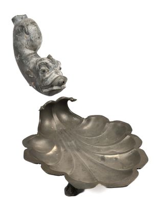 an image of a sculpture of a fish on a leaf