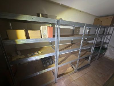 a room that has some shelves and boxes on it