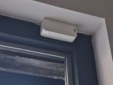 a small air conditioner on the side of a window