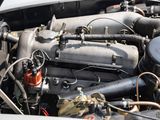 a close up of a car engine with its hood open