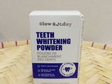 a box of teeth whitening powder sitting on top of a basket