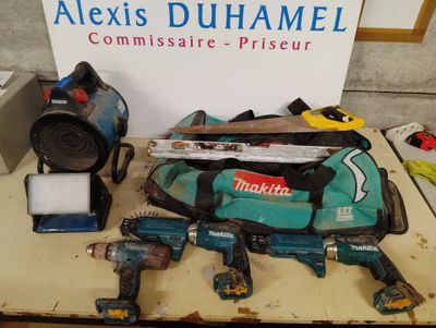 a table with tools on it and a sign that says alexis duhamel commissaire - prieur