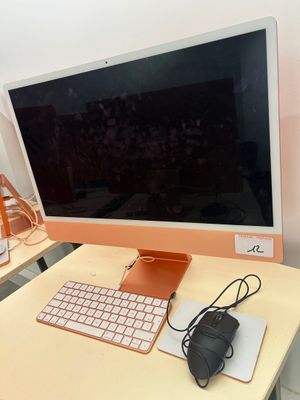 a computer on a desk with a keyboard and mouse