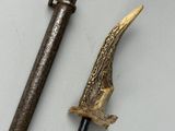 an image of a knife and a hammer on a white surface