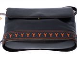 an image of a black purse with a brown and orange design