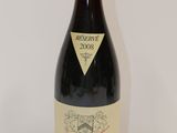 a bottle of wine that is sitting on a table