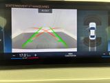a picture of a car ' s rear view monitor on a car ' s dashboard