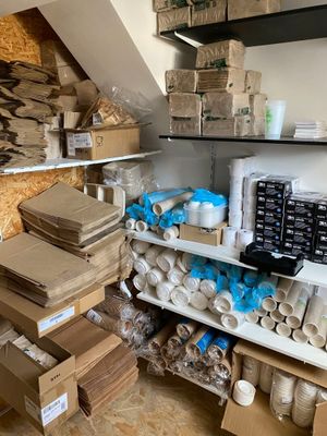 a room with a lot of boxes and boxes on the shelves