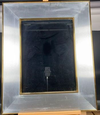 Un miroir encadrement laiton et aluminium années 70-80