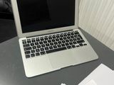 a laptop computer sitting on top of a table