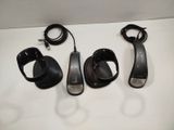 three pairs of sandals and a pair of earphones on a table